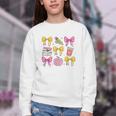 Apple Coquette Bow Books First Day Of School Back To School Youth Crewneck Sweatshirt Apple Coquette Bow Books First Day Of School Back To School Youth Crewneck Sweatshirt