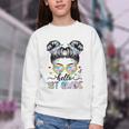 Hello 1st Grade Messy Bun Girl Back To School First Day Youth Crewneck Sweatshirt Hello 1st Grade Messy Bun Girl Back To School First Day Youth Crewneck Sweatshirt