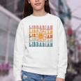 Librarian Retro Find Me At The Library Back To School Youth Crewneck Sweatshirt Librarian Retro Find Me At The Library Back To School Youth Crewneck Sweatshirt