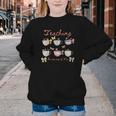Teaching Is My Cup Of Tea Coquette Bow Floral Back To School Youth Crewneck Sweatshirt Teaching Is My Cup Of Tea Coquette Bow Floral Back To School Youth Crewneck Sweatshirt