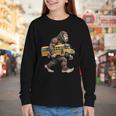 Bigfoot Carrying School Bus Sasquatch Back To School Youth Long Sleeve Tee Bigfoot Carrying School Bus Sasquatch Back To School Youth Long Sleeve Tee