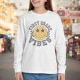 Retro First Grade Vibes Smile Face Back To School 1st Grade Youth Long Sleeve Tee